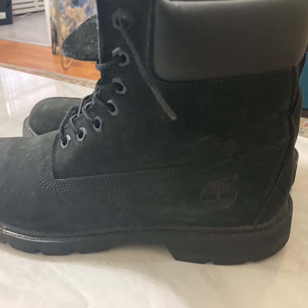 A pair black on black Timberland Boots